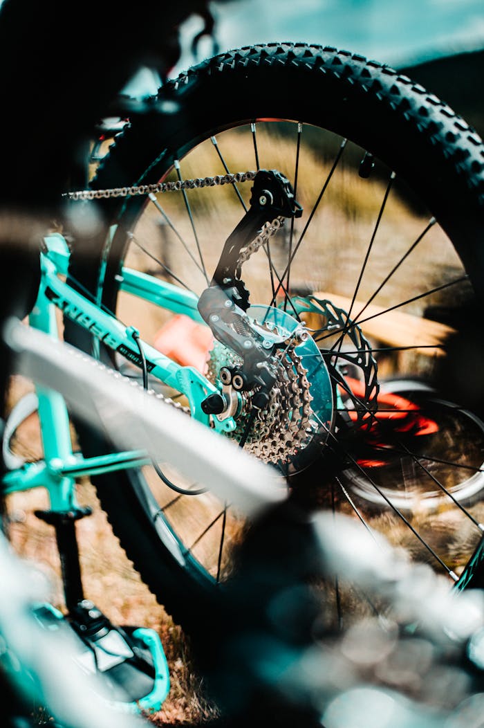 Detailed shot of a mountain bike's gear system, highlighting motion and sport outdoors.